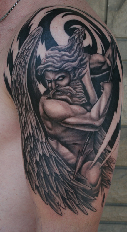 angel holding baby tattoo. the www.tattooroadtrip.com